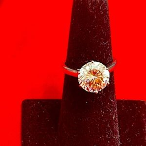 Moissanite 5 ct ring set in platinum over SS.